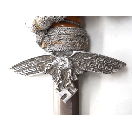 12 - WW2 German Luftwaffe 2nd Pattern Officers Dress Dagger. With scabbard, knot and hangers. Dagger has ... 