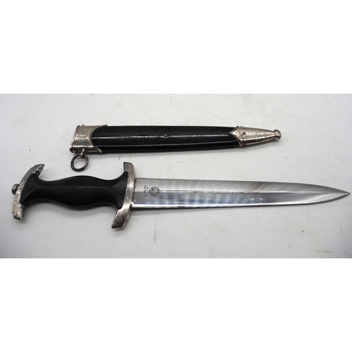 20 - Third Reich SS Dress Dagger. With ebony grip and aluminium eagle and enamel SS rune insignia. Double... 