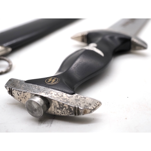20 - Third Reich SS Dress Dagger. With ebony grip and aluminium eagle and enamel SS rune insignia. Double... 