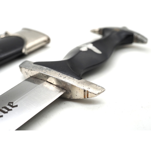 20 - Third Reich SS Dress Dagger. With ebony grip and aluminium eagle and enamel SS rune insignia. Double... 