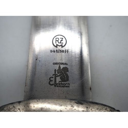 21 - Third Reich Transitional SS Dress Dagger.  Solingen. Ebony grip and aluminium eagle with enamel SS r... 