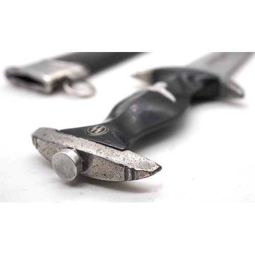 21 - Third Reich Transitional SS Dress Dagger.  Solingen. Ebony grip and aluminium eagle with enamel SS r... 