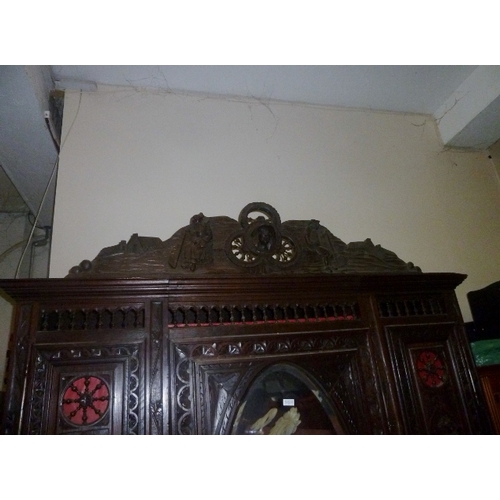 11 - Large Continental Heavily Carved Triple Wardrobe With Mirrored Door