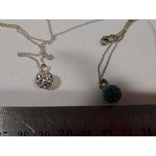 427 - 2 Silver Ball Pendants On Chains