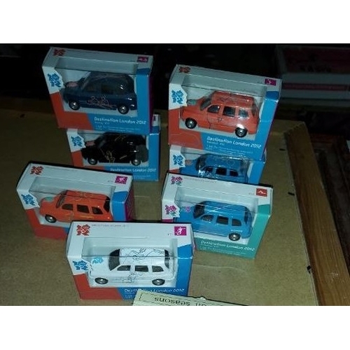 552 - 7 Corgi Taxi'S London Olympic 2012 Each Cab Has A Different Sport Logo All Mint And Boxed Scale 1.64