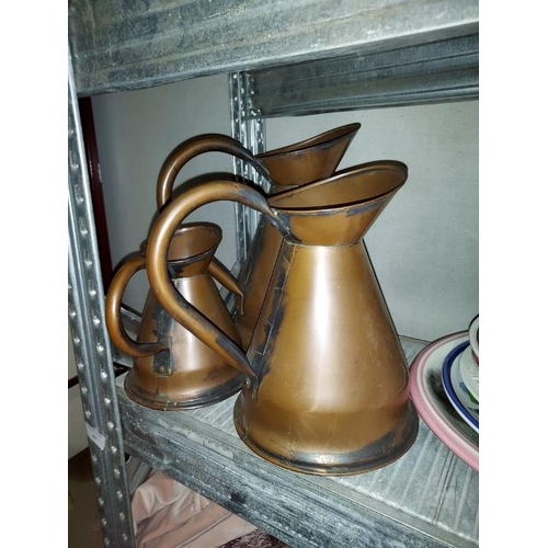 245 - 3 Graduating Copper Measuring Jugs