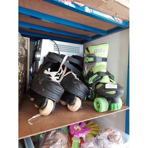 27 - 2 Pairs Of Roller Skates