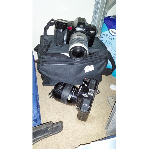 154 - 2 Minolta Cameras, 1 With Bag And Accessories