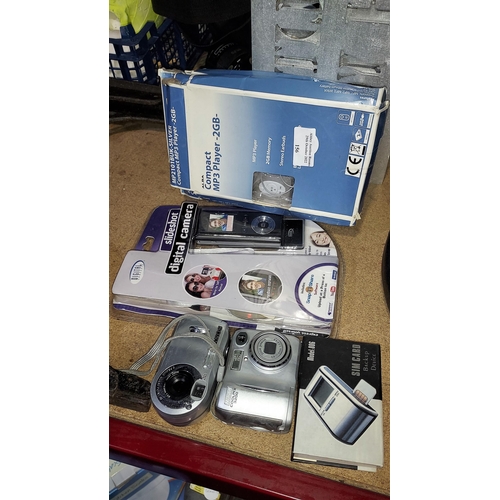 156 - 3 Digital Cameras, Sim Card Back Up Device Plus 3 Compact Mp3 Players