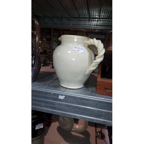 447 - Beige Water Jug With Rope Handle. Mark To Base