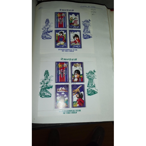 571 - Red Stamp Album With Stamps