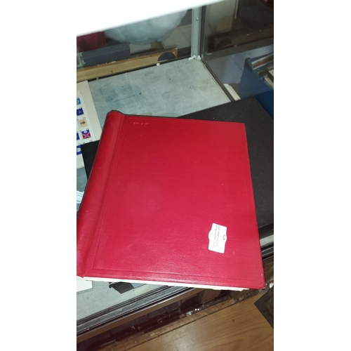 571 - Red Stamp Album With Stamps