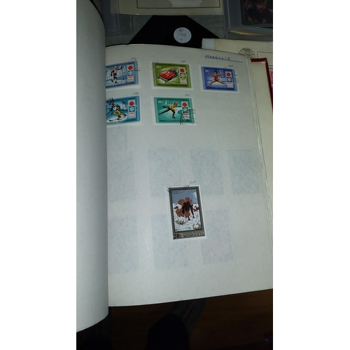 561 - Red Stamp Album With Stamps