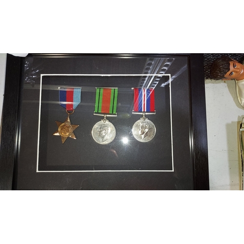 159 - Original Framed WW2 Medal Trio, 1939-45 Star, Defense Medal And War Medal