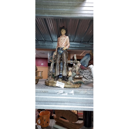 440 - Cowboy Leaning Against Fence Figurine