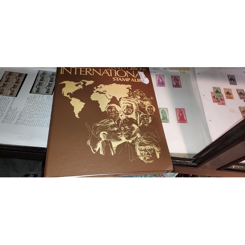 591 - Stanley Gibbons Stamp Album + Many Stamps