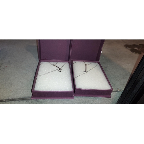 343 - 2 Silver Necklaces With Pendants In Boxes