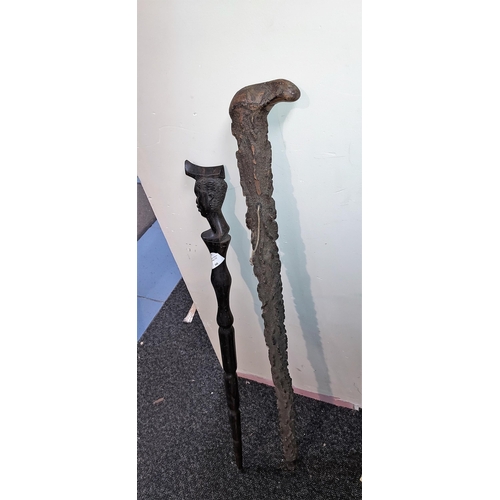 660 - 2 Carved Wooden Walking Sticks