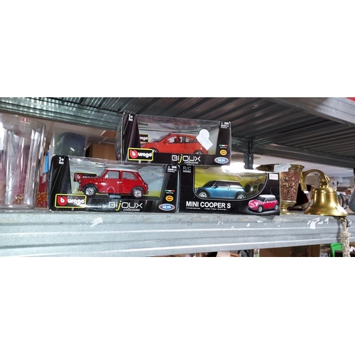 425 - 3 Boxed Burago Diecast Cars