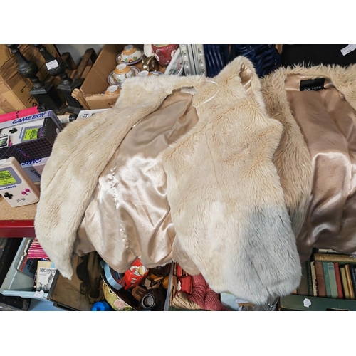 598 - Bag Of Furry Jackets And Others Including A Designer One