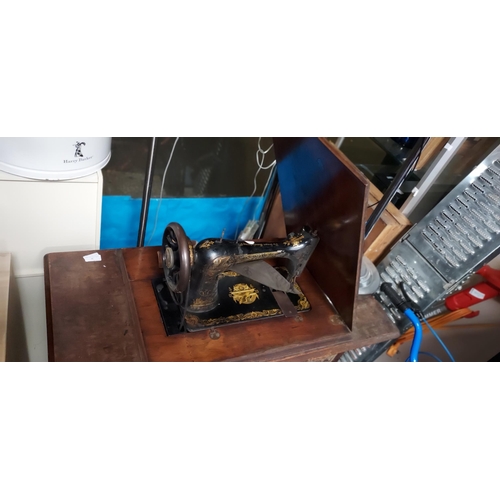 50 - Singer Sewing Machine In Table