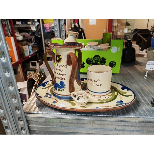461 - 4 Pieces Of Cornish Mottowear, 3 Handled Vase, A Cup, A Plate And Miniature Jug A/F