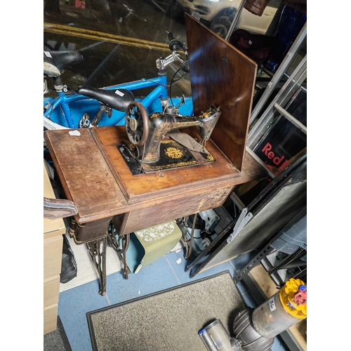 68 - Singer Sewing Machine In Table