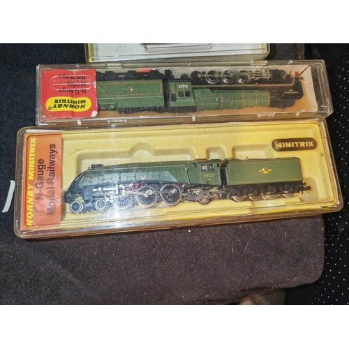 168 - 3 Hornby Mini Trix Carriages And 2 Trains In Cases