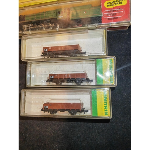 168 - 3 Hornby Mini Trix Carriages And 2 Trains In Cases