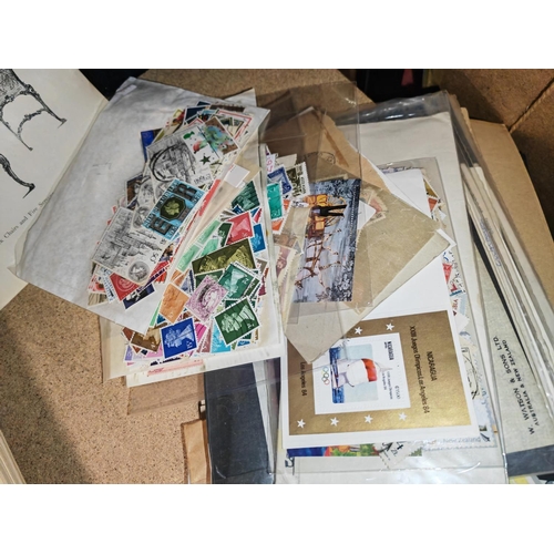 11 - Bag Of Worldwide Stamps In Packets And Pages