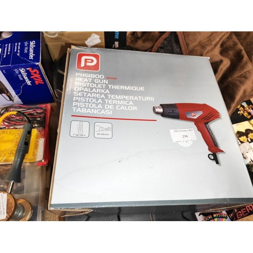 216 - Electric Saw With Blade Plus A Hot Air Gun