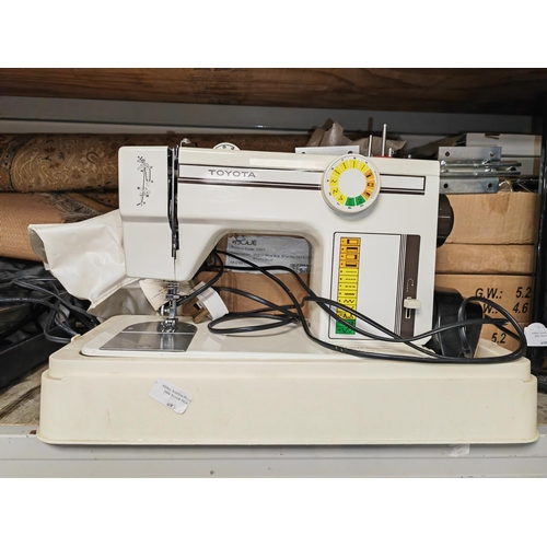 697 - Toyota Sewing Machine With Cover