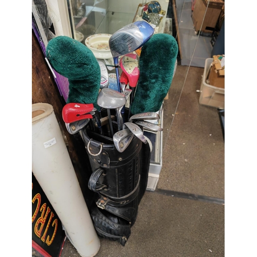 98 - Emblem Golf Clubs In Bag