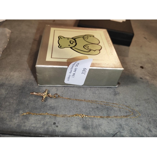 339 - 9Ct Gold Cross On 9Ct Gold Chain Weights 1.2Gms