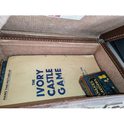 29 - 2 Small Brown Suitcases 1 With Tools And 1 With Games