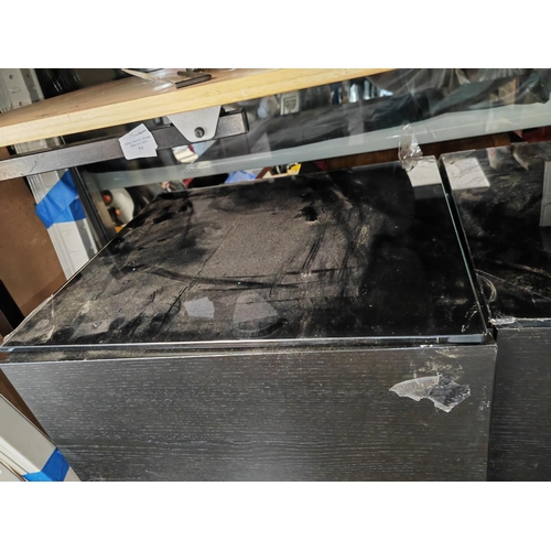 86 - 2 Black Glass Topped Bedside Tables