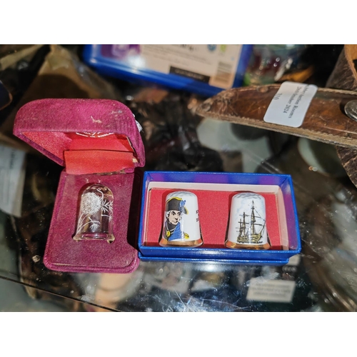 311 - 2 China Thimbles Lord Nelson And Hms Victory In Box Plus A Hand Painted Glass Thimble In Box