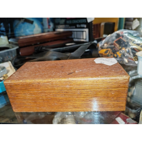 313 - Oak Box Of Jewellery With Some Low Grade Silver Brooches, Skull Etc