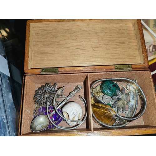 292 - Oak Box Of Jewellery With Some Low Grade Silver Brooches, Skull Etc