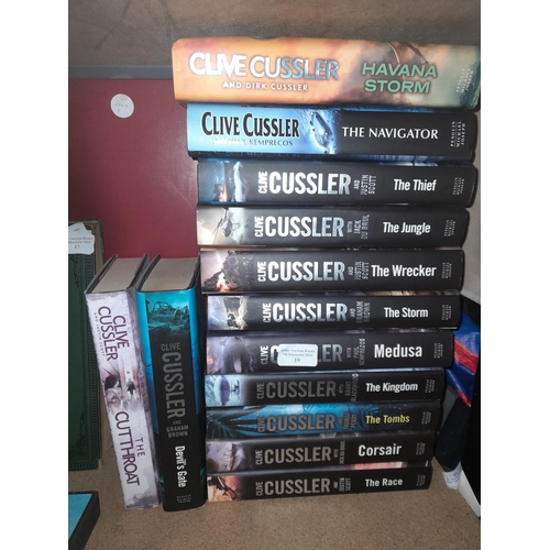 19 - Stack Of Hardback Novels By Clive Cussler