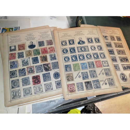 571 - Wide World Issue Stamps On Pages