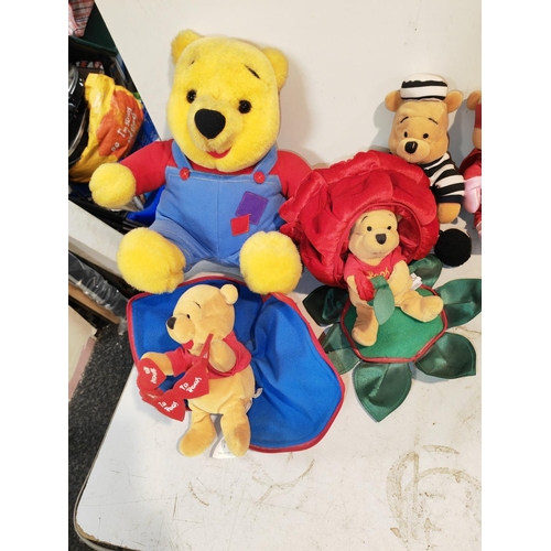 68 - 8 Winnie The Pooh Soft Toys Including Battery Operated One