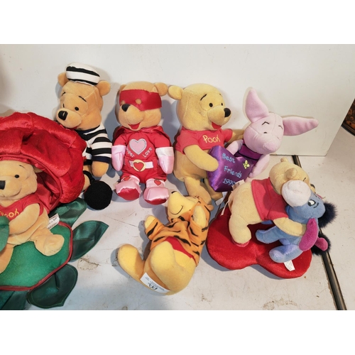 68 - 8 Winnie The Pooh Soft Toys Including Battery Operated One