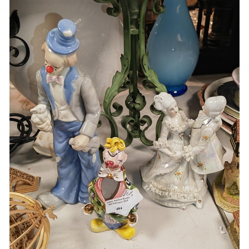 484 - 2 China Clowns Plus A China Lady And Gent Figurine