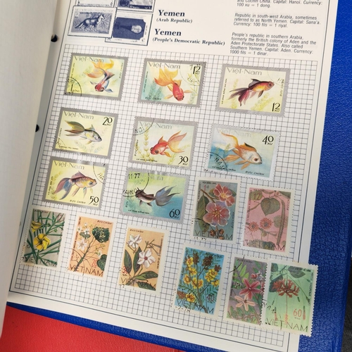 546 - Trident Stamp Album With Some Stamps And Red Ring Binder Of World Stamps Plus One Other Album