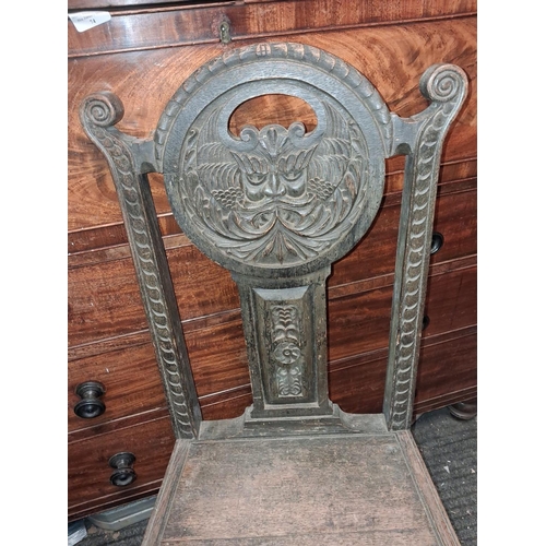 73 - Carved Oak Green Man Chair With Solid Chair