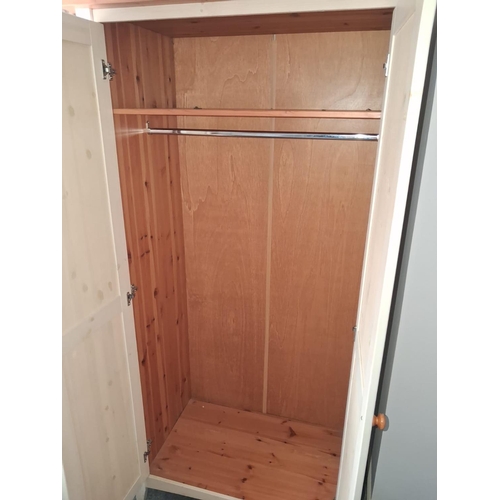 112 - 2 Door Pine Wardrobe In A Light Wash Finish