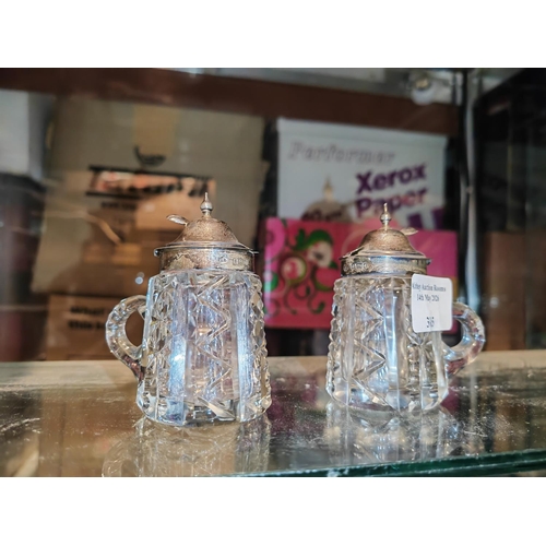 305 - 2 Silver Topped Mustard Pots