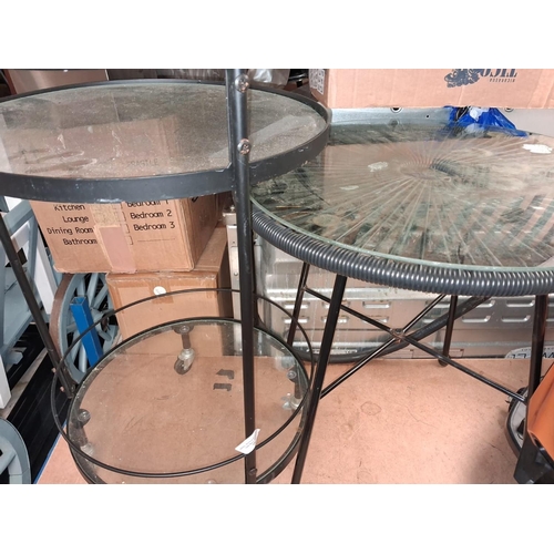 75 - Wheeled Black Trollery And Round Glass Topped Table