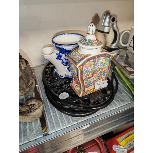 185 - 2 Cast Iron Trivets Plus A Oriental Tea Caddy And Moustache Cup